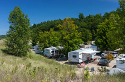 view of trailers park in campsites on sunny day in Charles Mears State Park